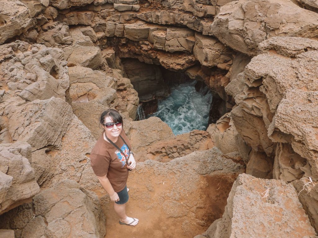 Chris with a blow hole at South Point on the Big Island