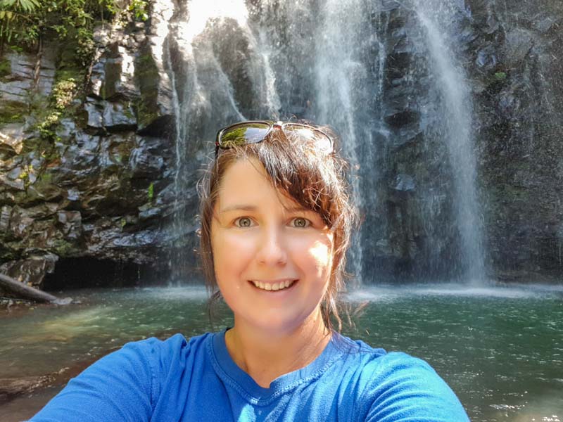 Chris standing in the waters at Ellinjaa Falls