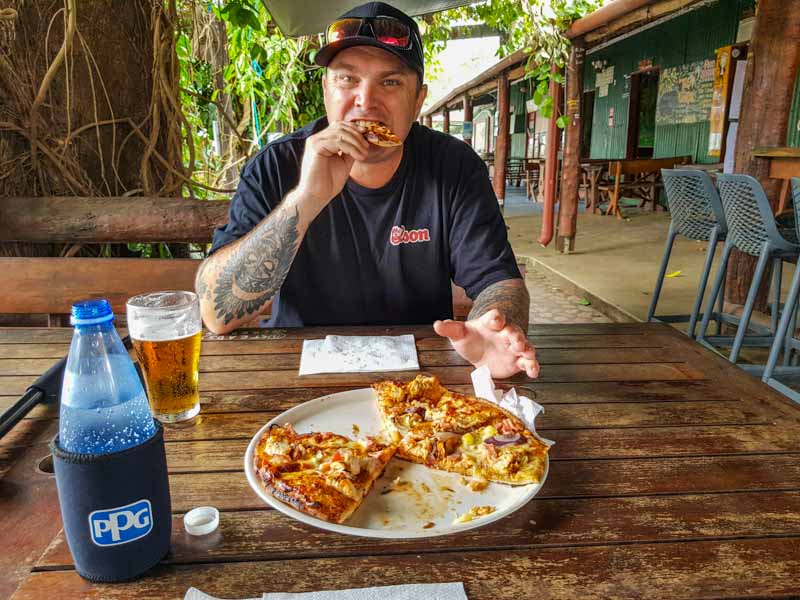Matt enjoying a beer & pizza at the Lions Den Hotel