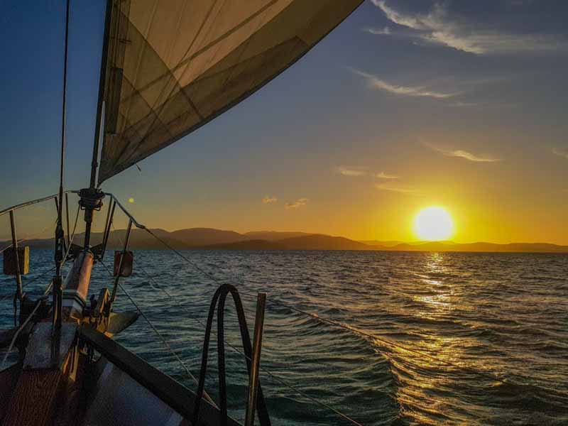 Watching the sun set from a boat cruise