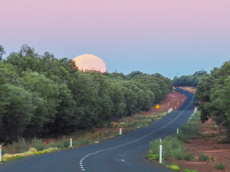 Sunrise with Moon over the road in Outback Queensland